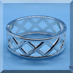 J31. Silvertone x hinged bangle bracelet - $6